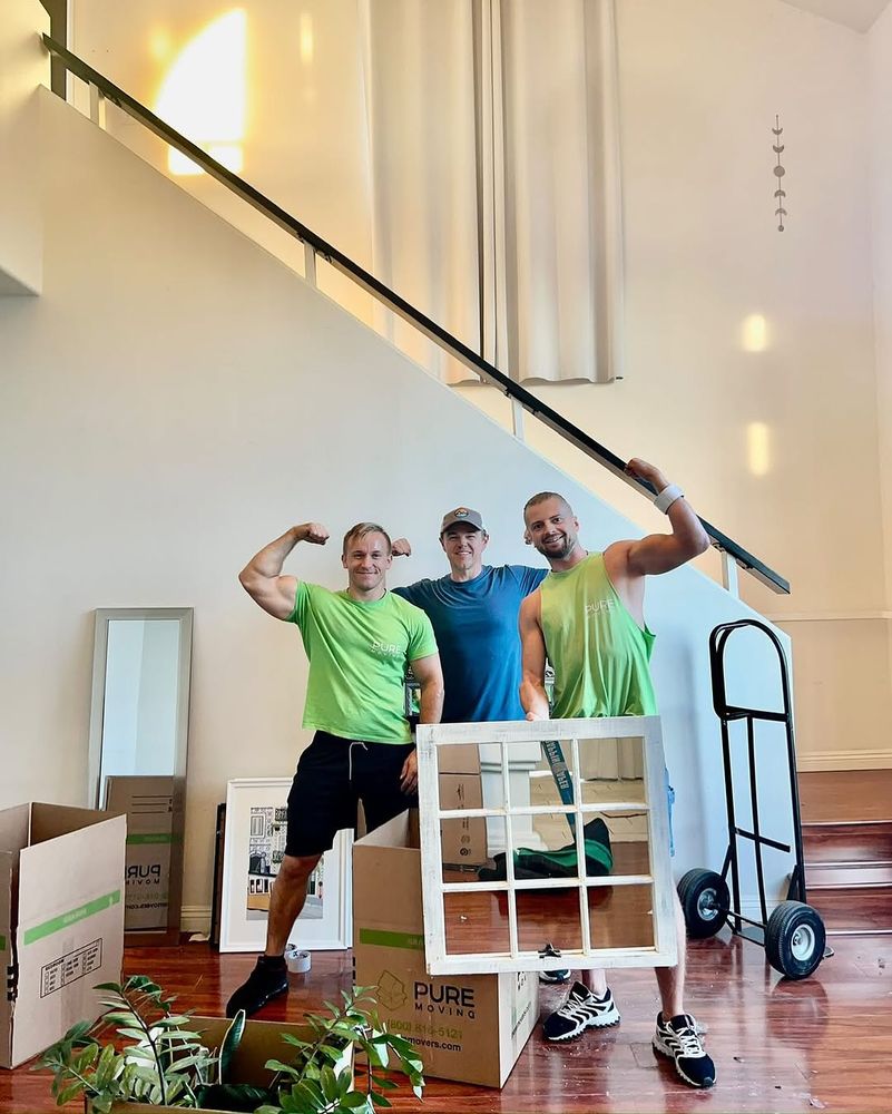 Moving company crew with customer during residential move setup