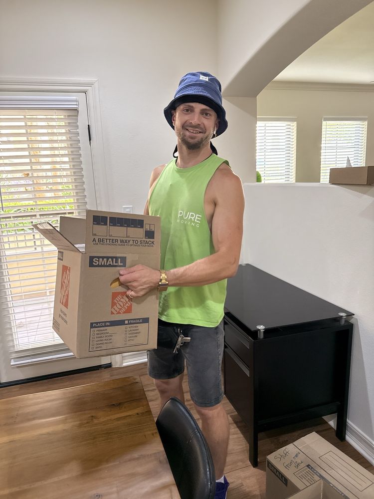 Commercial movers packing office items during business relocation