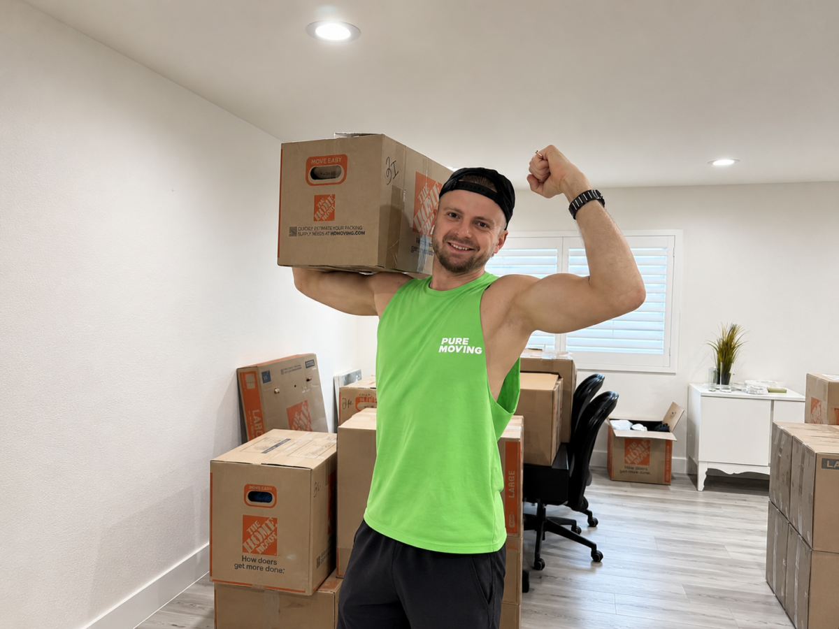 Pure Moving mover carrying moving box during residential move