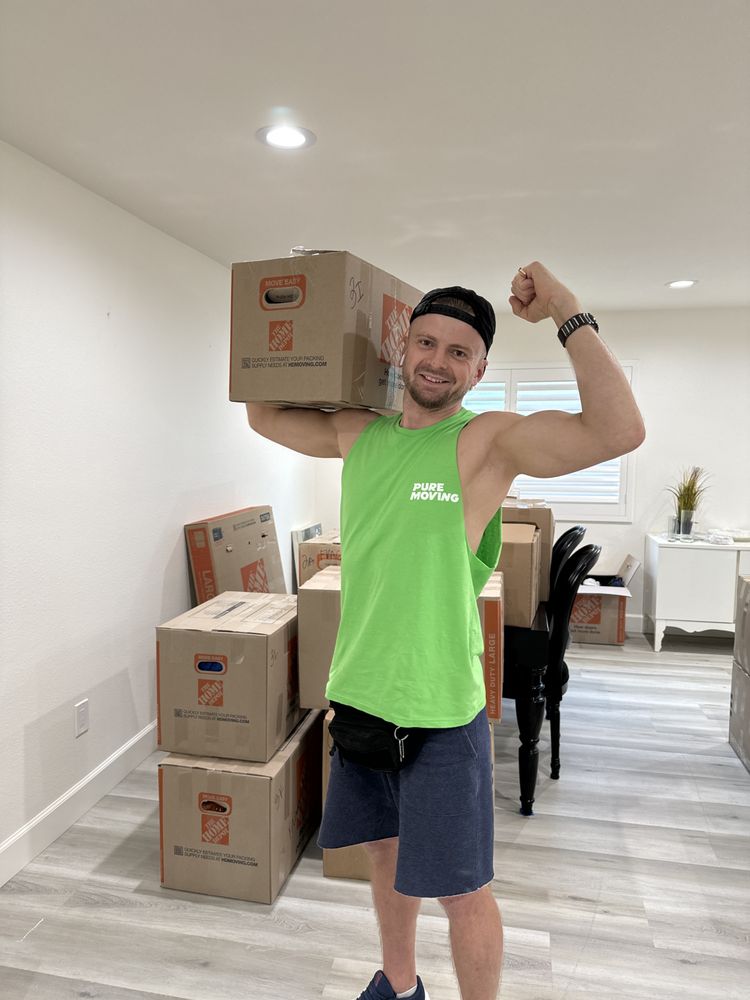 Pure Moving mover carrying moving box during residential move